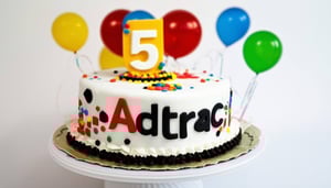 A birthday cake with the Adtrac Logo and a big number 5 on it